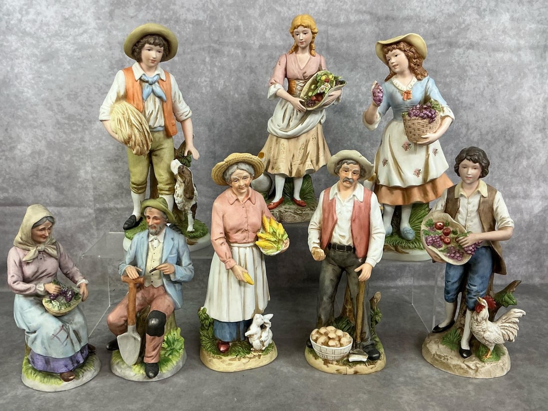 Farmer Figurines by Homeco: Eight late 1900's men and women farm figures. Antique washed painted figures with farm animals and produce. In good condition. Boy with dog measures 4.5 inches wide x 3.75 x 11 inches tall.