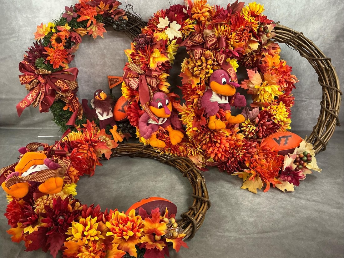 A Tech Wreathes & Ribbon: Four decorated Va Tech Hokie wreathes and 9 large spools of ribbon. Handmade wreathes in Hokie colors with flowers, mini footballs and Hokie birds. Also large Hokie colored and printed ribbon for