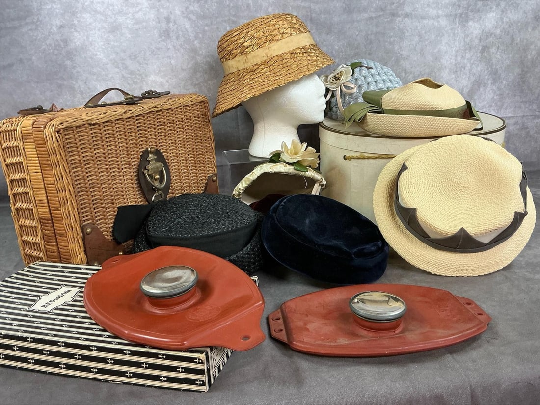 Vintage Hats, Wicker Case, & Rubber Ice Caps: Eight early to mid 1900's women's hats, two ice caps, and basket. Variety of hats with round hatbox. Wicker case with leather strap and accents. Two rubber ice caps, one in original BF Goodrich box.