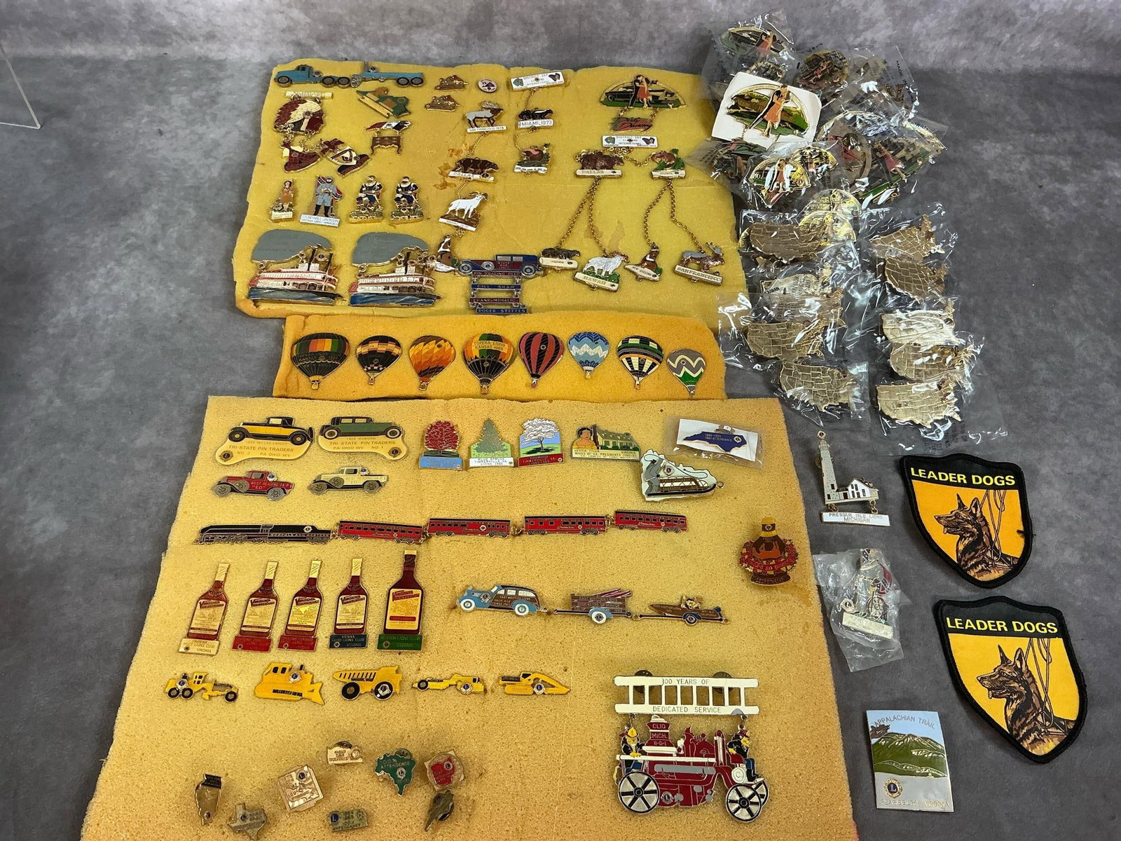 Vintage Lions Club Pins & Awards: Over 100 pins and 2 patches from 1950's - 2000's. Includes 29 Dirty Dancing Anniversary pins, 10 gold tone map of United States pins, hot air balloons, automobiles, historic figures, and more. Two