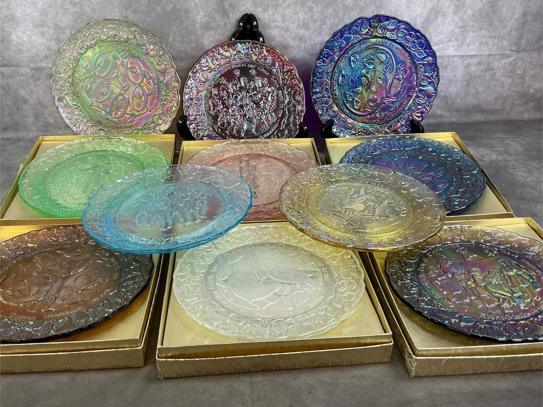 Twelve Days of Chrisrmas Plates: Eleven 1970's collectible Imperial Glass plates. Assorted iridescent carnival glass plates featuring scenes from each "day of Christmas ". (Missing second day). Most in original box and in good