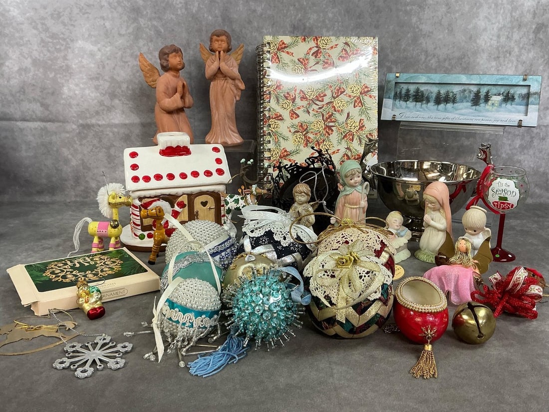 Christmas Collectibles: Twenty-nine mid to late 1900's Christmas decorations. Thirteen assorted ornaments and eight fabric and decorative Christmas balls. Terra cotta praying angels, spiral notebook, picture, silvertone