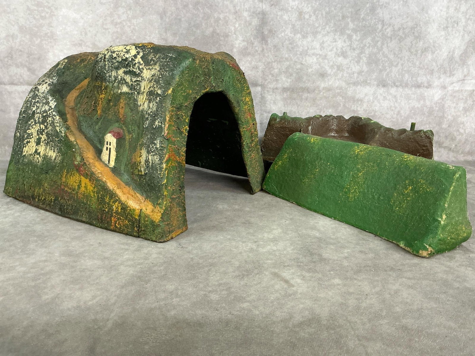 Vintage Train Tunnel: Three early to mid 1900's toy train tunnel and landscape pieces. Handpainted paper-mache lightweight molded pieces. Bottom edges are rough on smaller pieces. Tunnel measures 11 inches wide x 10 x 8.5