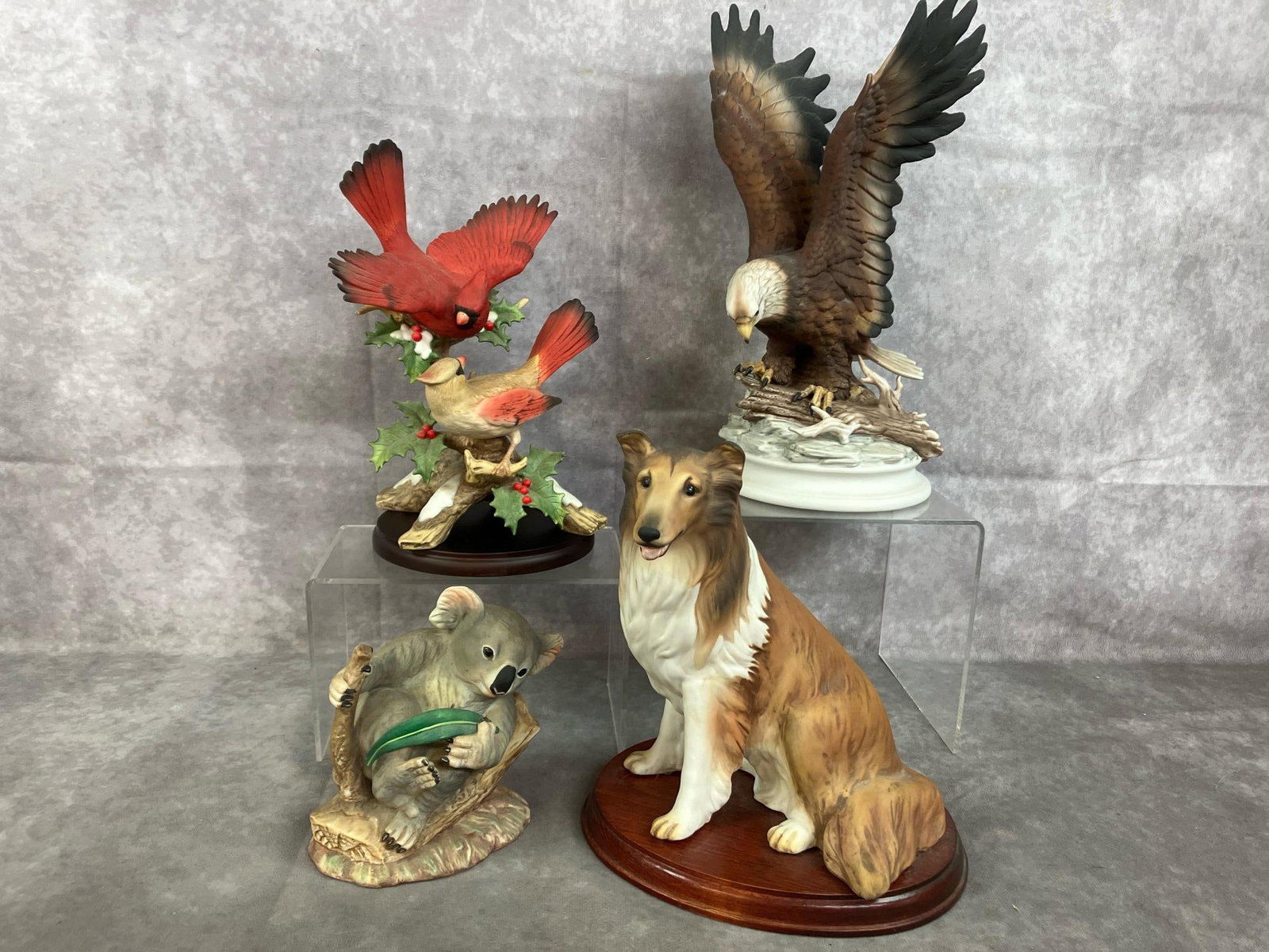 Porcelain Eagle, Collie, & More: Four late 1900's porcelain figurines. Eagle, Collie, and Cardinals by Homeco. Koala figure made in Mexico. All in good condition. Eagle measures 5 inches wide x 12 inches tall.