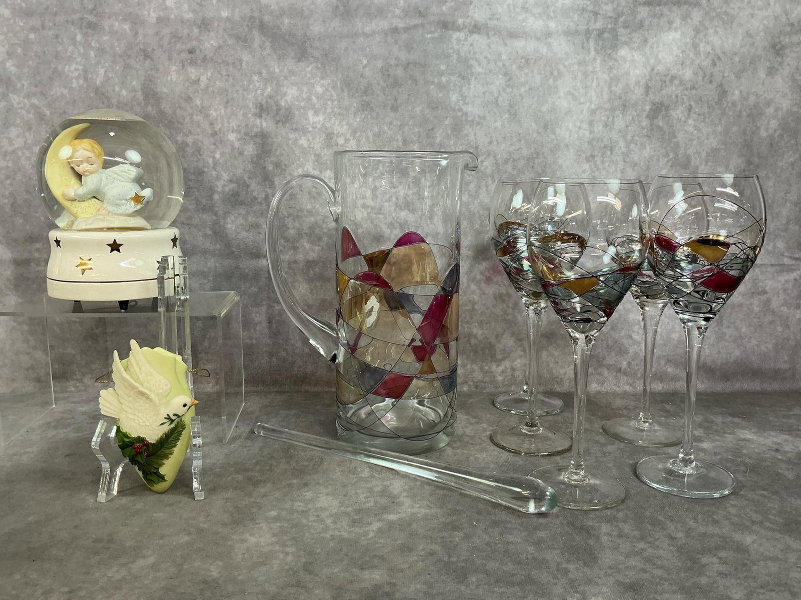 Barcelona Glass, Music Globe, & Ornament: Nine late 1900's pieces. Barcelona art pitcher with five glasses and glass stirrer. San Francisco music globe with baby angel on moon plays "When you wish upon a star". Porcelain Christmas ornament