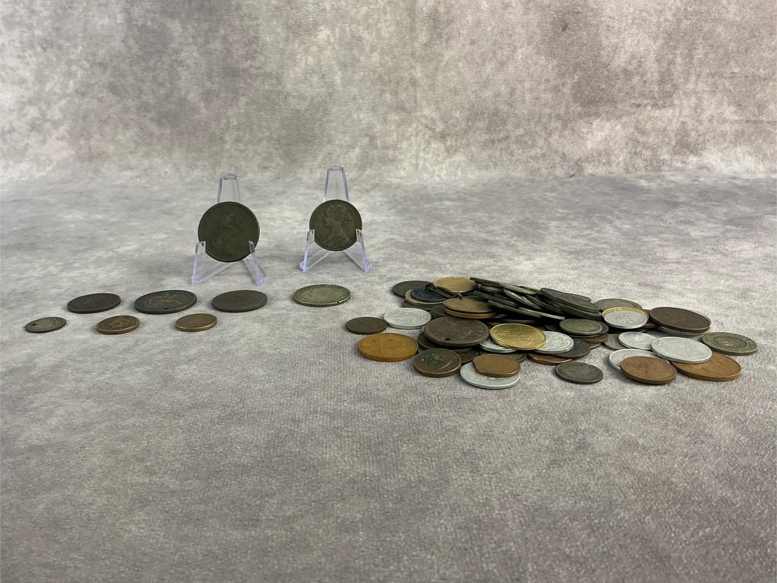 1800s Coinage: Approximately thirty foreign and domestic coins from the 1800s. All in fair to good condition. Largest coin measures 1.25 inches in diameter.