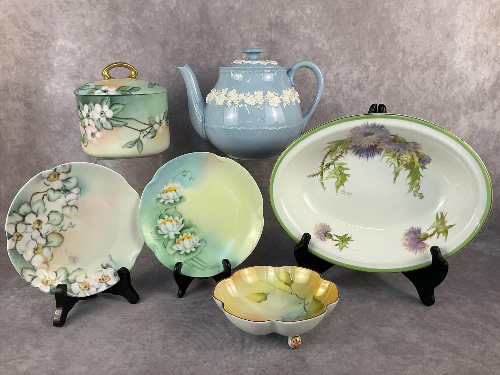 Wedgewood Teapot & More: Six fine china collectible items. Includes a Royal Doulton Glamus Thistle serving bowl, a small unmarked footed candy dish, a MZ Austria lidded dish, two small Bavaria plates and a Wedgewood Teapot.