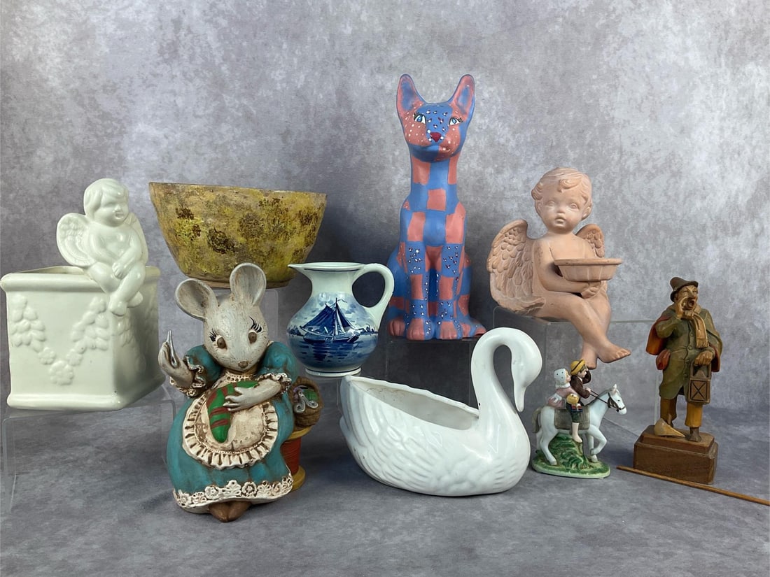 Norman Rockwell Figurine & More: Nine vintage items. Lot includes a handpainted Delft Holland mini pitcher, a Norman Rockwell "Off to Schoo" 1984 figurine and a carved wood "Town Crier" figurine. Painted cat measures 4 inches long x