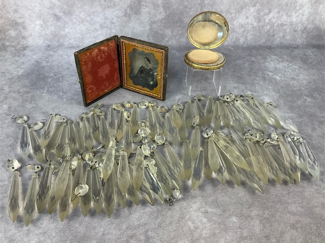 Crystal Prisms & More: Seventy two vintage glass prisms, leather-bound daguerreotype, and a compact. Picture measures 3.25 inches long x 3 inches wide.