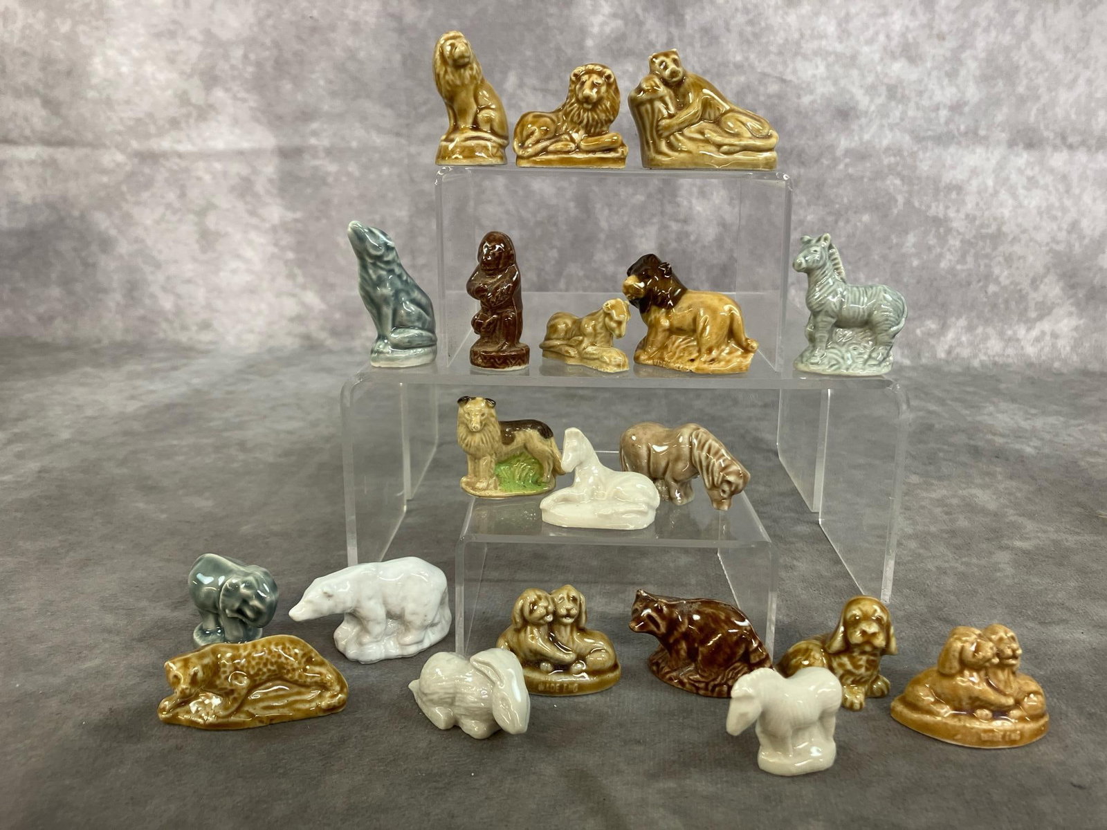 Animal Miniatures by Wade: Twenty mid 1900's Whimsies by Wade of England miniatures. Porcelain wild and farm animals. In good condition. Reclining monkey measures 1.75 inches wide x 1 x 1.25 inches tall.