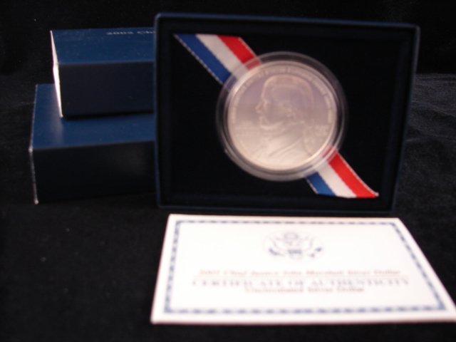 Two 2005 John Marshall Silver dollars: one proof, one UNC, in box with COA