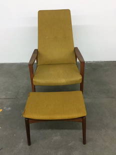 DANISH ARM CHAIR AND OTTOMAN: SOME TEARS IN FABRIC STAPLES ON BACK CHAIR 40" HEIGHT 25.5" WIDTH 33" DEEP SEAT 15" HEIGHT 21" DEPTH OTTOMAN 14.5" DEEP 21"WIDTH