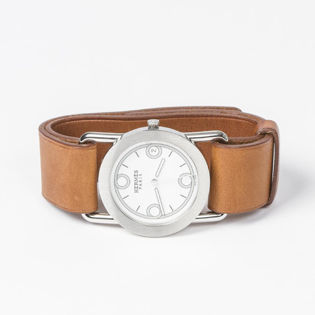 Hermes Barenia Rondo 1.710: Hermes Barenia Rondo 1.710 in Brown/Silver Barenia Leather. Excellent condition. Stainless Steel without Nickel hardware. White Dial. Dimensions Dial: 35*35mm / Bracelet: 23cm. Weight of 61,2g. Produc