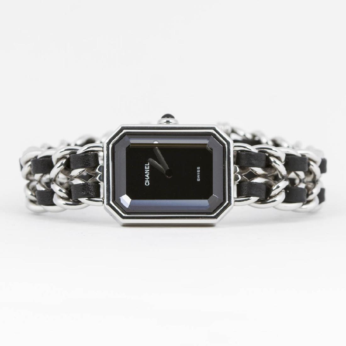 Chanel Premiere: Chanel Premiere M in Silver tone. Stainless steel without nickel with black interlaced leather hardware. Perfect condition. Black Dial. Dimensions Dial:20*25mm / Bracelet:15cm. Weight of 39,4g. Jewelr
