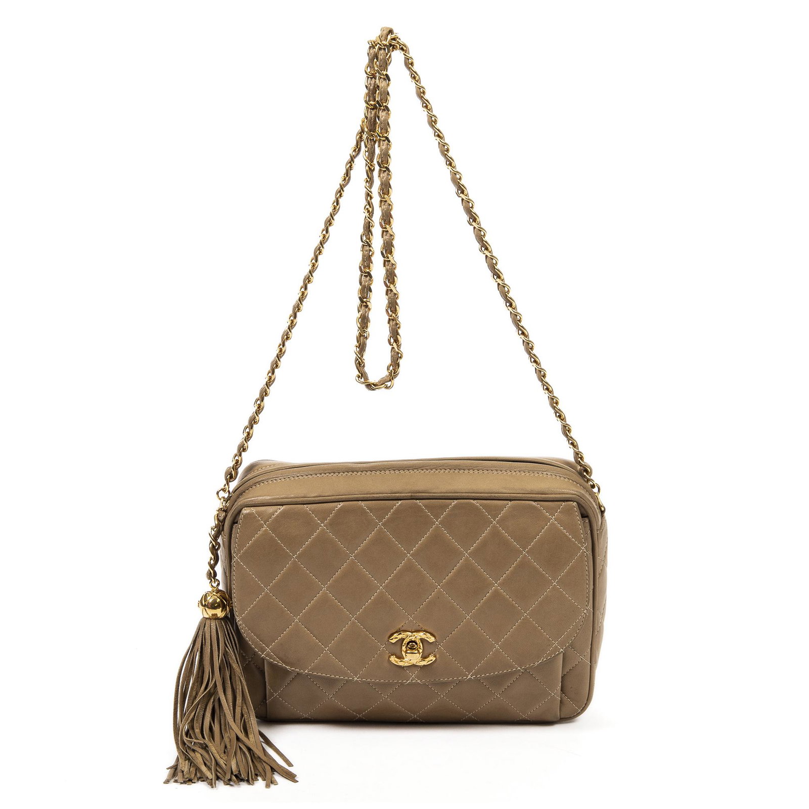 Chanel Calf Leather Tassel Front Flap Bag: Pre-loved Chanel Tassel Front Flap Bag in Beige Calf Leather and Gold hardware. Brands Identifier : 2941559. Dimensions: 22*16*6cm. The Item comes with Hologram, Card, Dustbag. All BrandCo Paris items