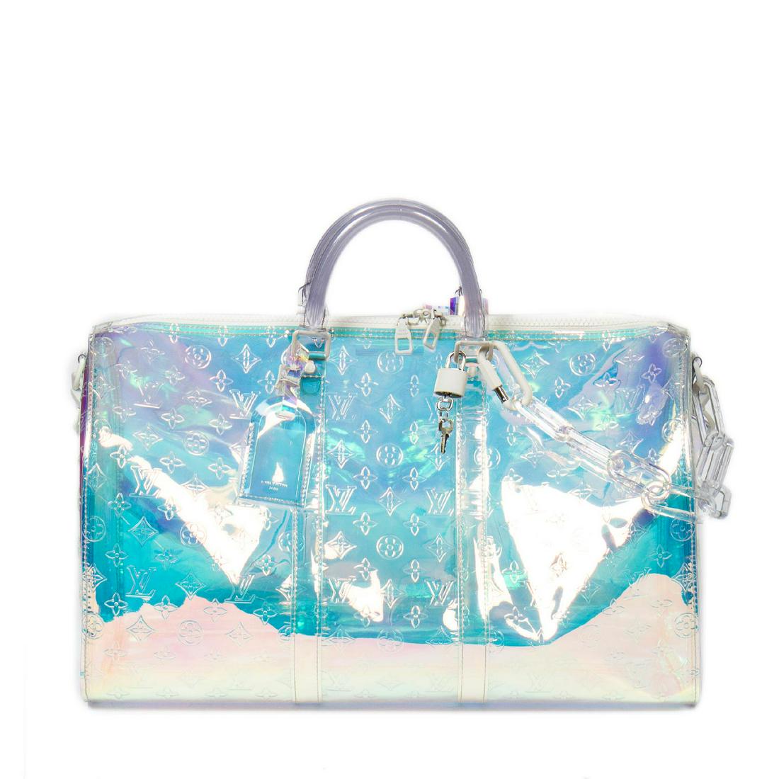 Louis Vuitton Coated Canvas Keepall Bandouliere 50: Pre-loved Louis Vuitton Keepall Bandouliere 50 in Prism Coated Canvas and White Lucite hardware. Brands Identifier : DR1179. Dimensions: 50*26*22cm. The Item comes with Luggage Tag, Dustabag, Strap, C