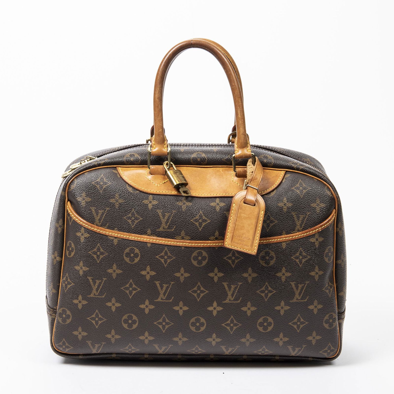 Louis Vuitton Deauville: Pre-loved Louis Vuitton Deauville in Brown coated Monogram Canvas with Vachetta leather Handles. The hardware is in Golden Brass. Dimensions (L*H*D in cm): 35*26*14cm. Brand Production Code : MB0953.