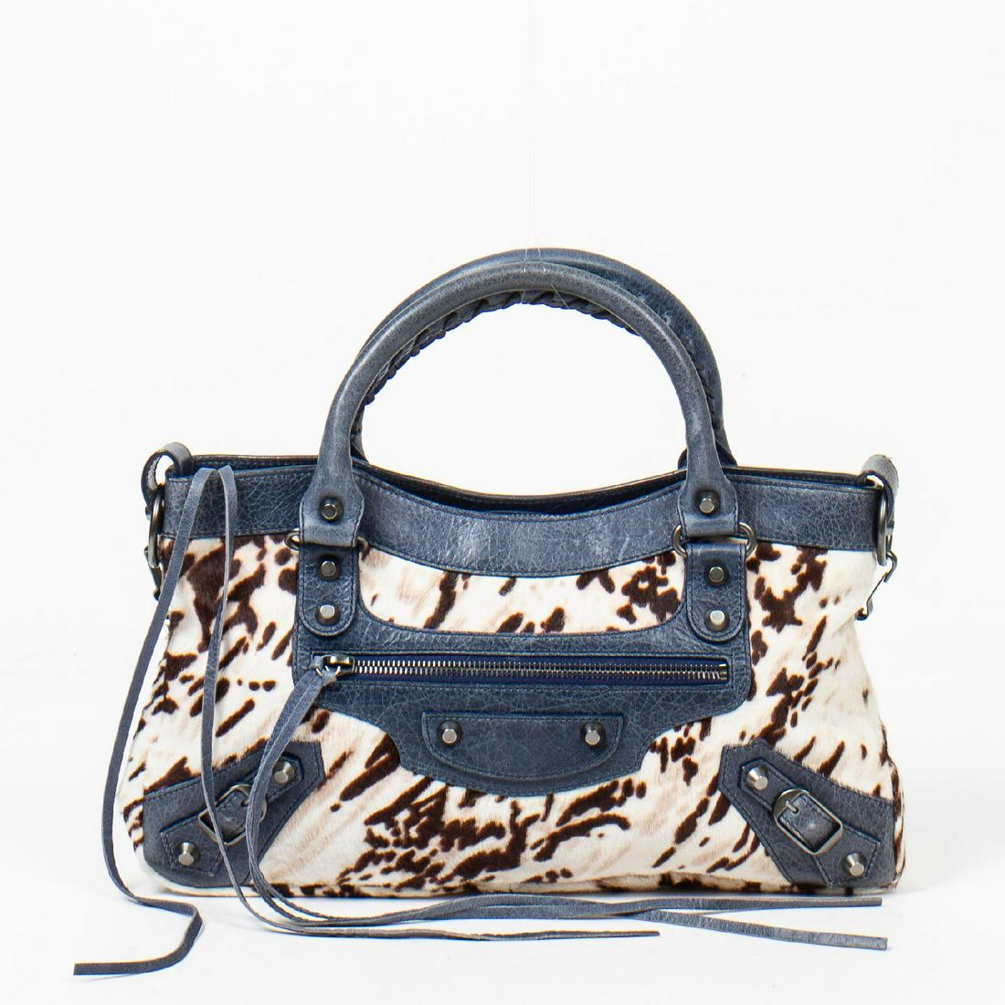 Balenciaga Arena First Anniversary: Pre-loved Balenciaga Arena First Anniversary in Dark Blue and Grey Tiger Print Pony Hair with Dark Blue Grey Leather Handles. The hardware is in Antique Silver metal. Dimensions (L*H*D in cm): 32*19*5