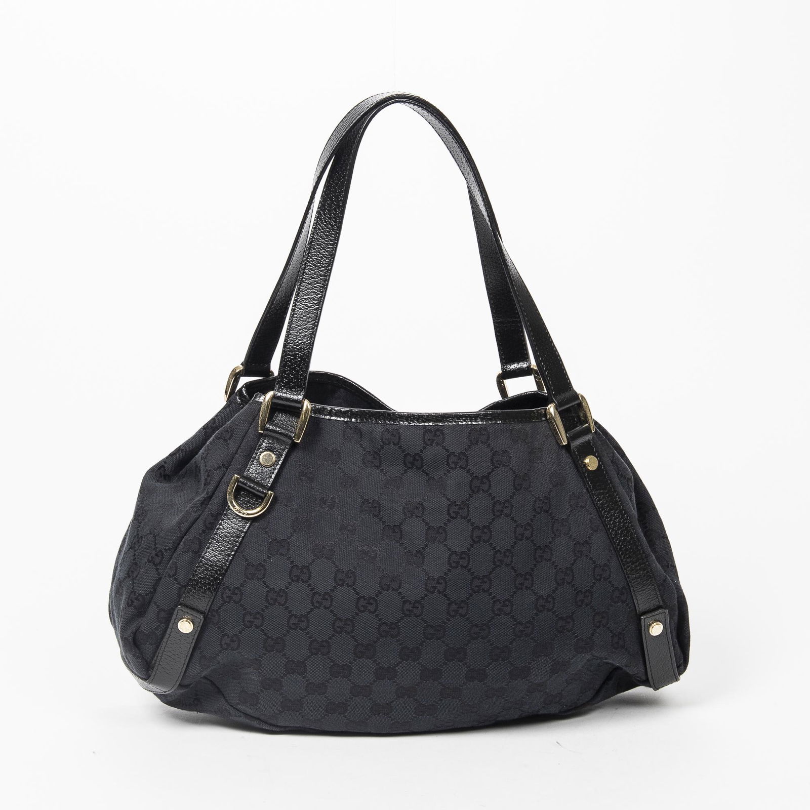 Gucci Abbey Hobo Diagonal Line: Pre-loved Gucci Abbey Hobo Diagonal Line in Black Monogrammed Canvas with Black Leather Strap. The hardware is in Gold metal. Dimensions (L*H*D in cm): 40*24*11cm. Brand Production Code : 130736-3444.