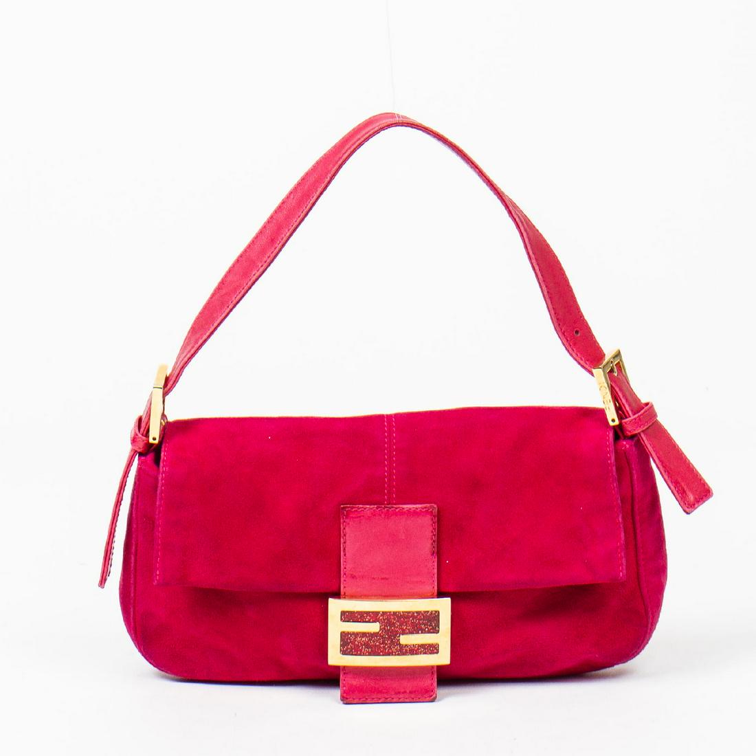 Fendi Baguette: Pre-loved Fendi Baguette in Fuchsia Pink Suede Leather with Fuchsia Pink Leather Straps. The hardware is in Gold metal. Dimensions (L*H*D in cm): 25*13*4cm. Brand Production Code : 811**64-1009. Very 