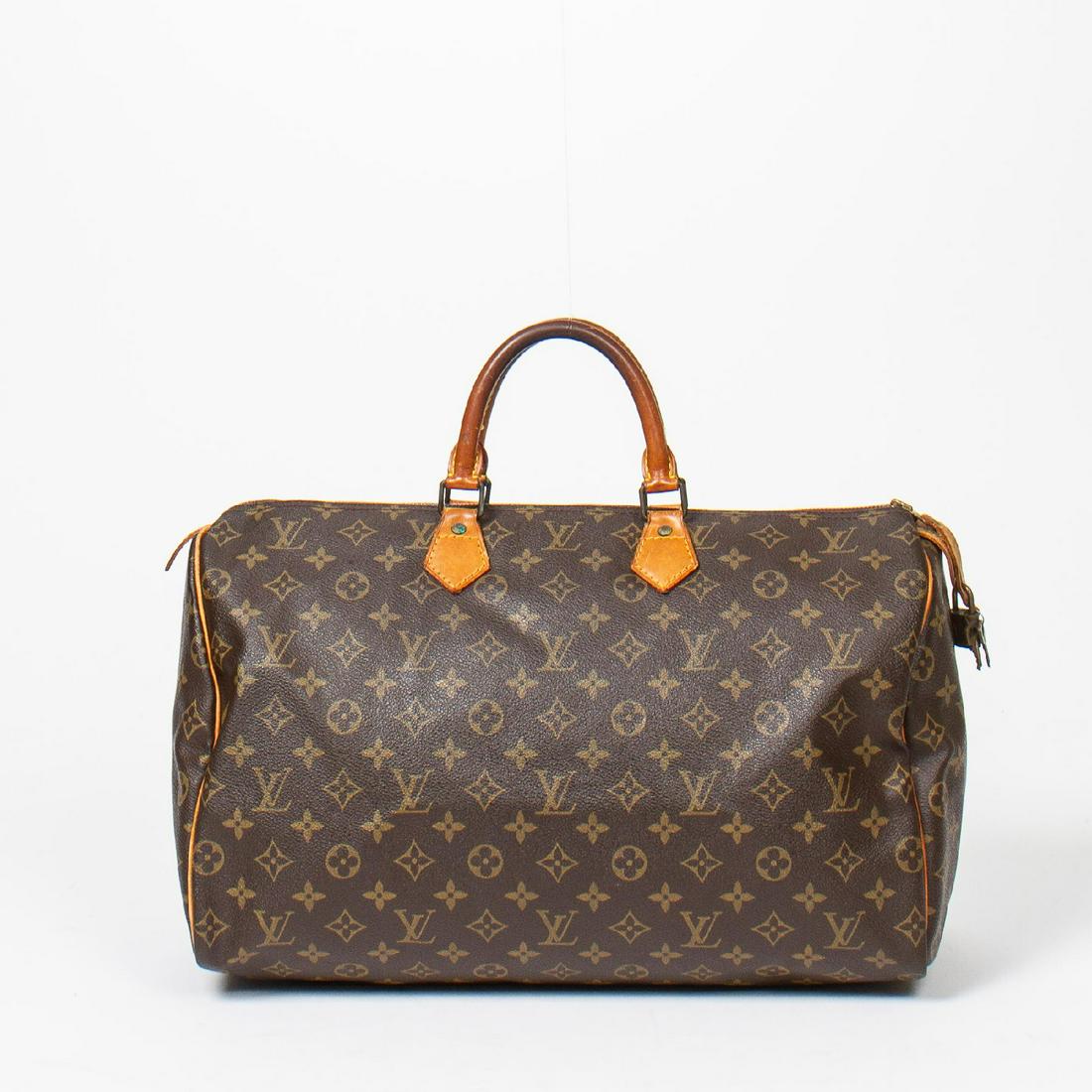 Louis Vuitton Speedy 40: Pre-loved Louis Vuitton Speedy 40 in Brown coated Monogram Canvas with Vachetta leather Handles. The hardware is in Golden Brass. Dimensions (L*H*D in cm): 40*24*19cm. Brand Production Code : VI871. T