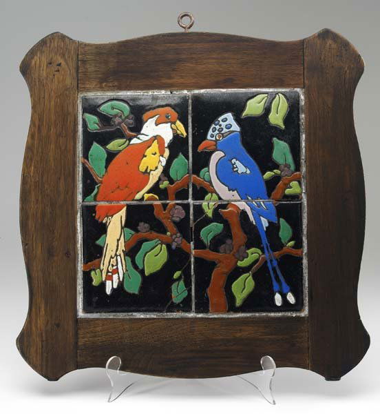 TAYLOR Tiled table top with two exotic birds: TAYLOR Tiled table top with two exotic birds in polychrome. Original wooden frame. Cracks to two tiles. Tiles: 6" each, Panel: 19" sq.