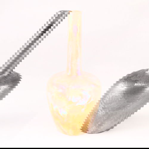 CLEMENT MASSIER Bottle-shaped vase painted with Ar: CLEMENT MASSIER Bottle-shaped vase painted with Art Nouveau flowers in a gold, purple and green lustered glaze. Restoration around rim. Signed Clement Massier Golfe-Juan. 11 3/4" x 5 1/4"