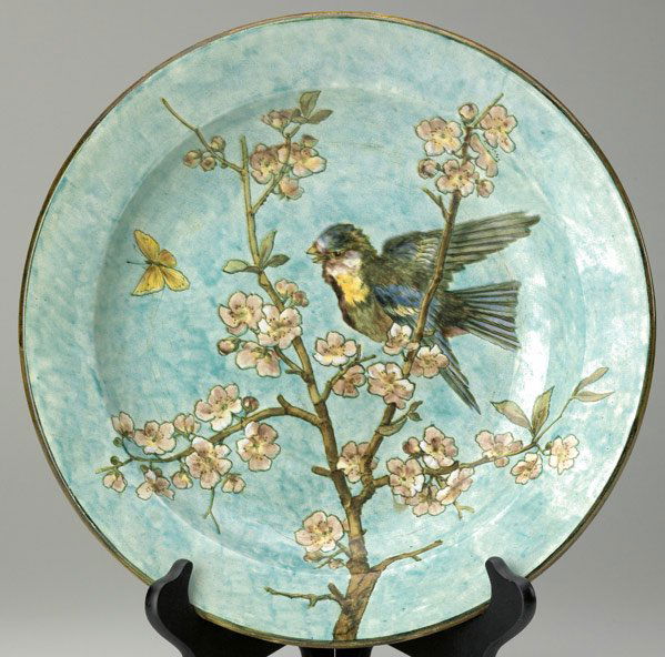 JOHN BENNETT Beautifully painted charger: JOHN BENNETT Charger beautifully painted with a bird on a cherry blossom branch, c. 1877. 1/4" chip to center from firing, light wear. Signed J. BENNETT 101 Lex Avenue NY 1077. 2" x 12 3/4"