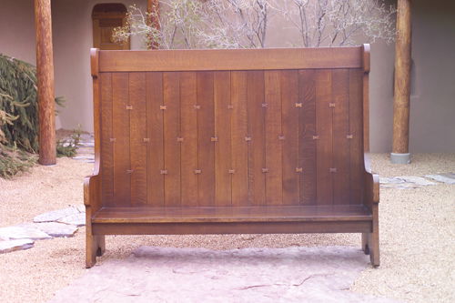GUSTAV STICKLEY Custom-made hall bench fastened wit: GUSTAV STICKLEY Custom-made hall bench fastened with butterfly joints, the top and bottom mortised through the sides, and "scalloped" base. Refinished, some replaced butterfly joints, minor checks to