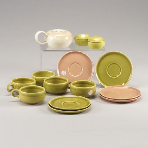 Fourteen RUSSEL WRIGHT pieces: white te: Fourteen RUSSEL WRIGHT pieces: white teapot (hairline), pair of salt and pepper shakers, five green cups, two green saucers, one pink saucer, and three bread plates in pink and green. A couple of smal