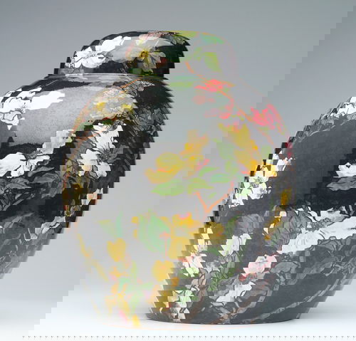 JOHN BENNETT Large covered jar painted with branch: JOHN BENNETT Large covered jar painted with branches of yellow dogwood and red roses on black ground, the interior of the lid with brown-eyed Susans on a golden ground, 1881. (Extraordinary.) From the