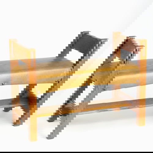 GUSTAV STICKLEY Window bench with tacked-on vinyl: GUSTAV STICKLEY Window bench with tacked-on vinyl seat and lower stretcher mortised through the side slats. New finish and upholstery, some looseness. Unmarked. 26" x 36" x 19"