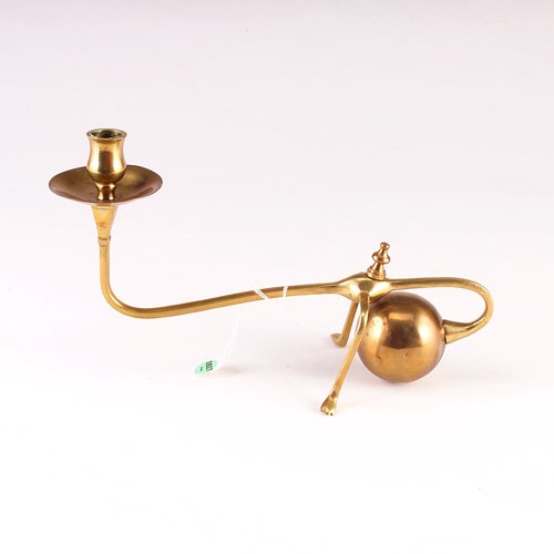 WILLIAM ARTHUR SMITH BENSON (ATTR.) Brass chambers: WILLIAM ARTHUR SMITH BENSON (ATTR.) Brass chamberstick with claw feet and ball weight. Unmarked. 8" x 12 1/2"