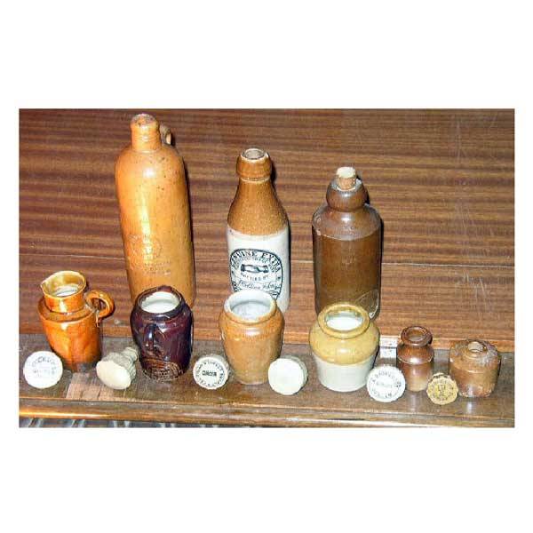Ceramics - A J Collins of Newcastle beer bottle,: Ceramics - A J Collins of Newcastle beer bottle, stoneware Bourne Denby trade marked beer bottle, a German bottle, six stoneware beer tops, two stoneware cream jugs, and three other stoneware pots. (A