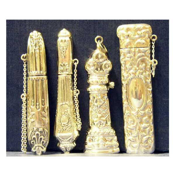 Silver - Four 925 hallmarked silver needle cases,: Silver - Four 925 hallmarked silver needle cases, mounted with safety chains, embossed in relief with foliate scrolling, one with hinged cover. (4)