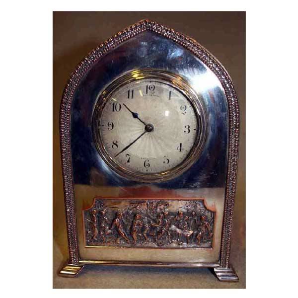 Clocks - A large silver plated mantel clock of go: Clocks - A large silver plated mantel clock of gothic shape with leaf moulded border, the circular dial enclosing French movement with Brook & Son of Edinburgh retailers name, the case set with rectan