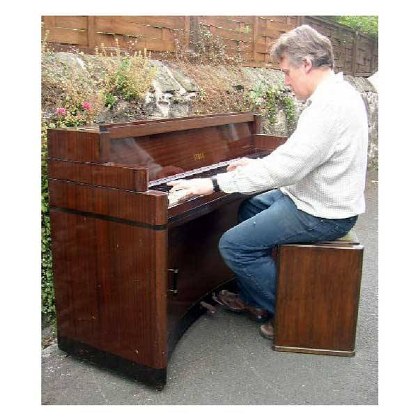 Musical - An art deco Steck piano, the seven octa: Musical - An art deco Steck piano, the seven octave keyboard in stepped case with James Smith & Sons retailers name, the concave frame with rounded corners inlaid with stained ebonised banding, suppor