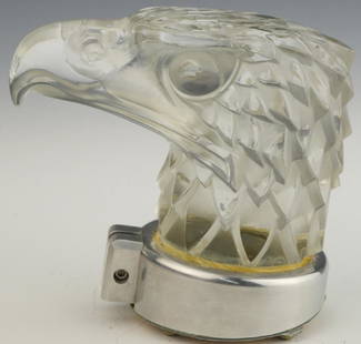 R. LALIQUE Tete d'Aigle Eagle Car Hood Ornament Mascot: RENE LALIQUE CLEAR AND FROSTED GLASS "TETE D'AIGLE" MASCOT Model introduced 1928. Signed R. LALIQUE FRANCE. Height 4 3/4 inches. Literature: R. Lalique Catalogue Raisonne by Felix Marcilhac, number