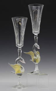 PAIR (2) Murano Art Glass Wine Champagne Flutes w/ Bird: Murano Italian glass champagne stems. Crafted of Italian Murano art glass. It features a swan like bird with a light pink beak and gold leaf accents on the wings. Comes with original label attached.