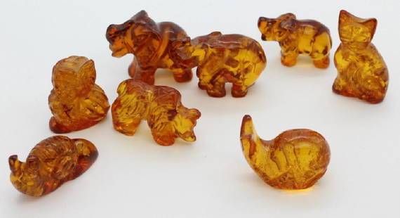 7 x Baltic Honey Amber Bear Cat Owl Whale Snail Statue: Lot of 7 whimsical miniature animal figurines. Crafted of solid natural amber. Features three elephants, one bear, one whale, one cat, one owl, and one snail. The smallest is 1" long while the