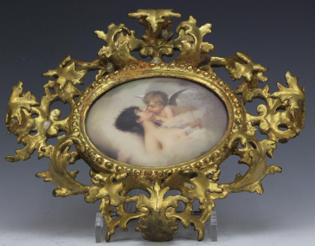 FINE German KPM Type Porcelain Angel Kiss Plaque FRAMED: Fine quality German Berlin "KPM Style" porcelain portrait plaque. Features an Angels kiss to a nude maiden. Oval porcelain plaque housed in an ornate gold gilt frame. Partial impressed numbers on back