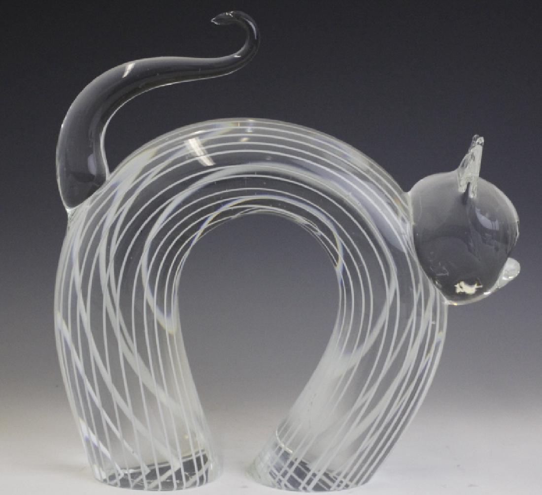 Zanetti Signed Murano Art Glass Cat Sculpture: Murano art glass cat by Licio Zanetti. Crafted of fine Italian glass. Depicts an ally cat with arched back. Clear crystal with white striping and curled tail. Signed/etched on bottom 'Zanetti'. Measur