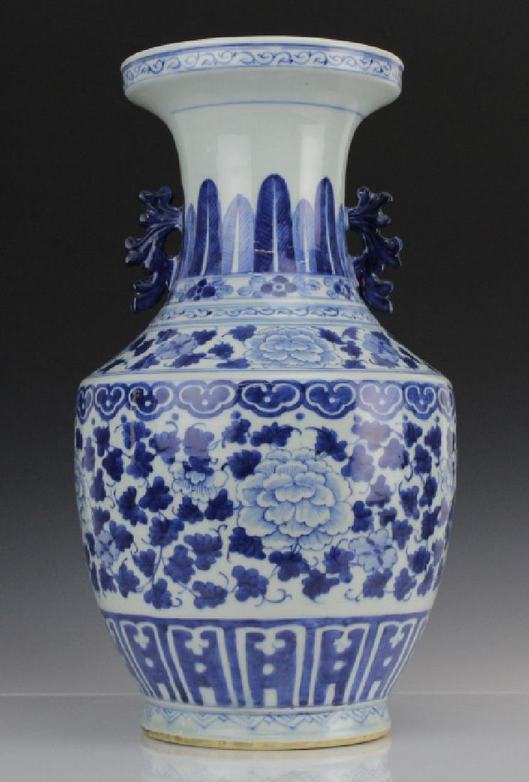 Chinese Porcelain Blue & White 17" Porcelain Vase: Chinese export porcelain vase. Features a floral pattern with geometric and palmate borders. Unmarked. Measures 17.5" x 10" Good condition with minor surface wear. Will not ship. Will refer a local sh
