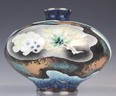 Signed Japanese Closonne Enamel Vase: Japanese cloisonné enamel vase. Features wide-shouldered tapered form with designs of abstract flowers and swirls of color. Base and rim lined with sterling silver. Marked on base. Measures 8" x 9".