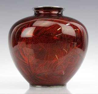 Ando Jubei Japanese Cloisonne Pigeon Blood Vase: Vase by Ando Jubei (1876-1953), Meiji period. Enamel features bamboo leaves on pigeon blood deep red ground. Marked on bottom. Top and base each have silver mounts. Very good condition. Measures 6