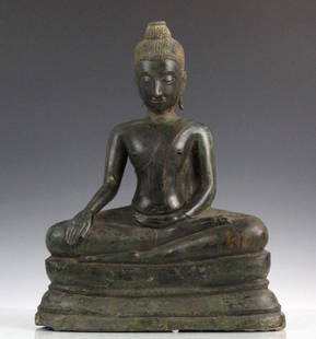 Antique Southeast Asian Bronze Seated Buddha: Cast bronze with deep patina. Features a seated southeast Asian style Buddha in meditation. Measures 14 1/2" x 12" Good condition with losses to base, hair top, and earlobe area . Older restorations