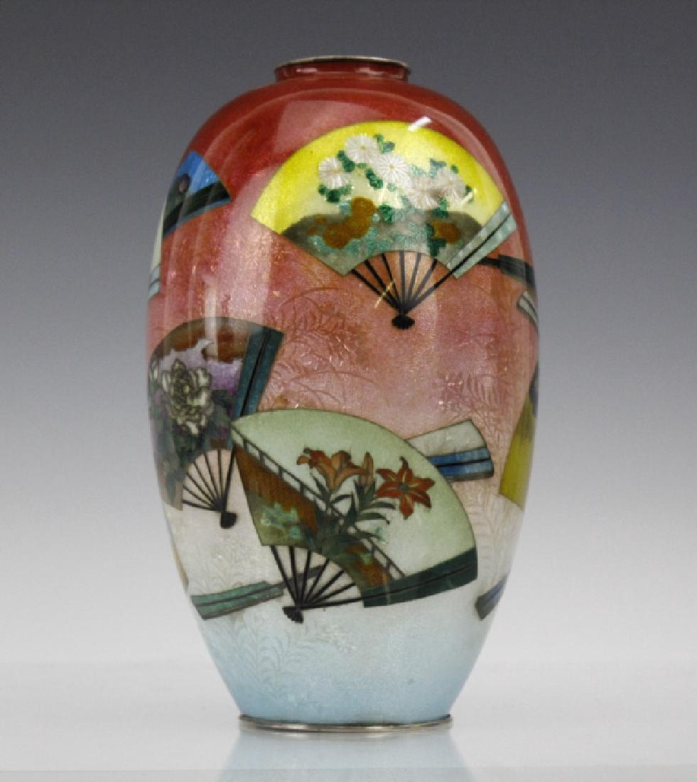 Japanese Cloisonne Enamel Vase Meiji Period: Very fine Japanese antique cloisonne enamel vase. Depicting classical fan and flower foliate decoration on tri-color ground. Measures 8" x 4". Very good condition. In house USA continental shipping $4