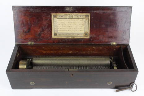 Antique Victorian Era Swiss Cylinder Music Box: Beautiful inlaid case with medallion center. Plays songs by Montaubry, Donicetti, Bellini and Dollman. Key wind mechanism. Working but needs a normal cleaning and oiling. Good condition with some