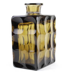 Modernist Topaz Glass Decanter Liqueur Bottle 7": Continental topaz colored crystal bottle. Features a modernist rectangular faceted design in a smoky colored crystal. Stopper not included. Signed on base. Measures 7" x 4.25" x 3". Small chip to