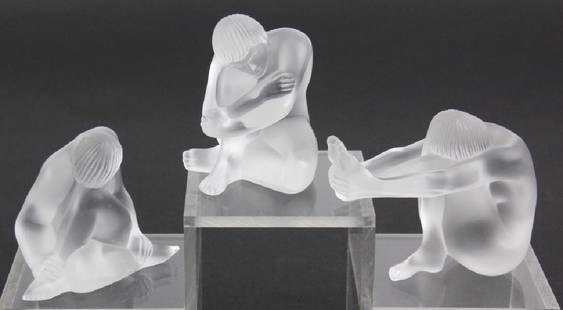 LOT of 3 Lalique French Art Glass Nude Figurine: Lot of three figurines/paperweights by Lalique. All of the pieces are crafted of fine quality French frosted art glass. Depicts three young nude female figures in different positions. All signed